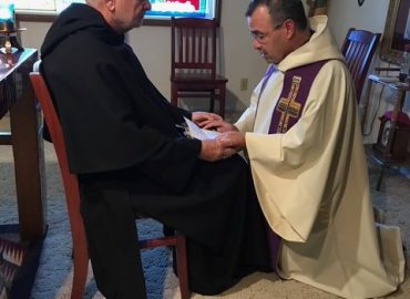Bro Richard receiving Fr Rudy's perpetual vows in the Motherhouse Chapel